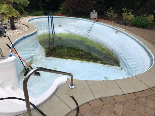 Before: worn or failed vinyl liner, Oval pool &mdash; new liner with a decorative waterline band