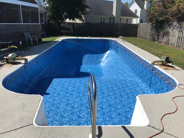 After: Rectangular pool with corner steps &mdash; new vinyl liner