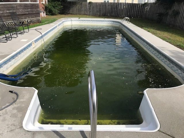 Before: worn or failed vinyl liner, Rectangular pool with corner steps &mdash; new vinyl liner